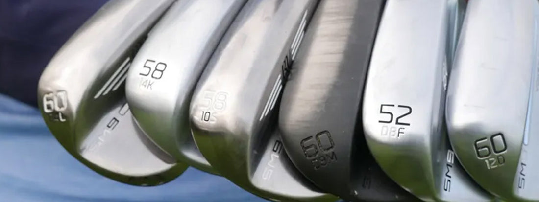 Close-up of golf clubs with different numbers on the heads against a blurred background
