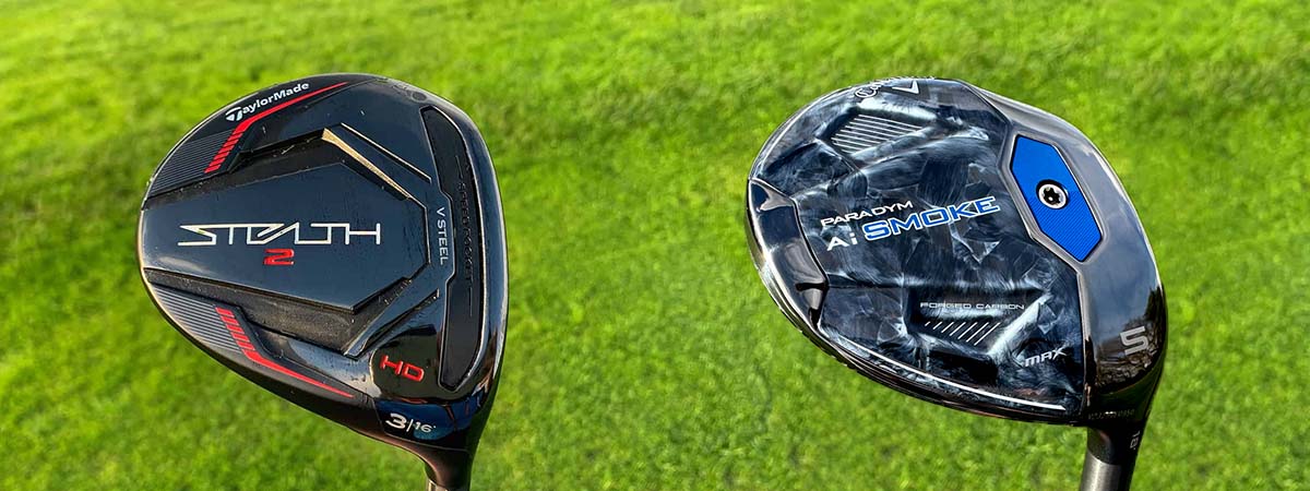 Two golf club heads, one labeled 'Stealth' and the other 'Ai Smoke', on a grass background.