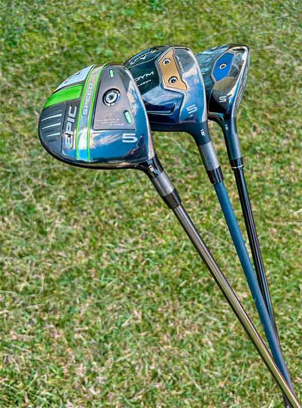 Three golf fairways on a grassy background