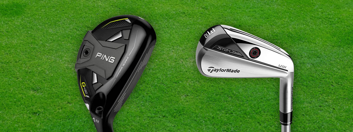 Two golf clubs, one black and one silver, on a green background