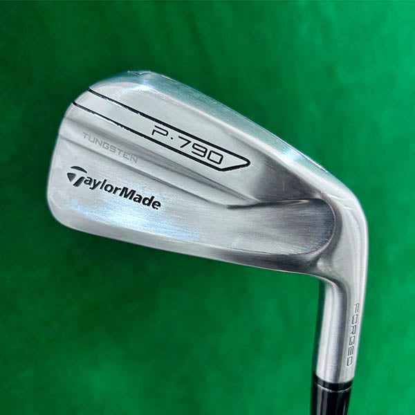 TaylorMade P790 golf club on a green background